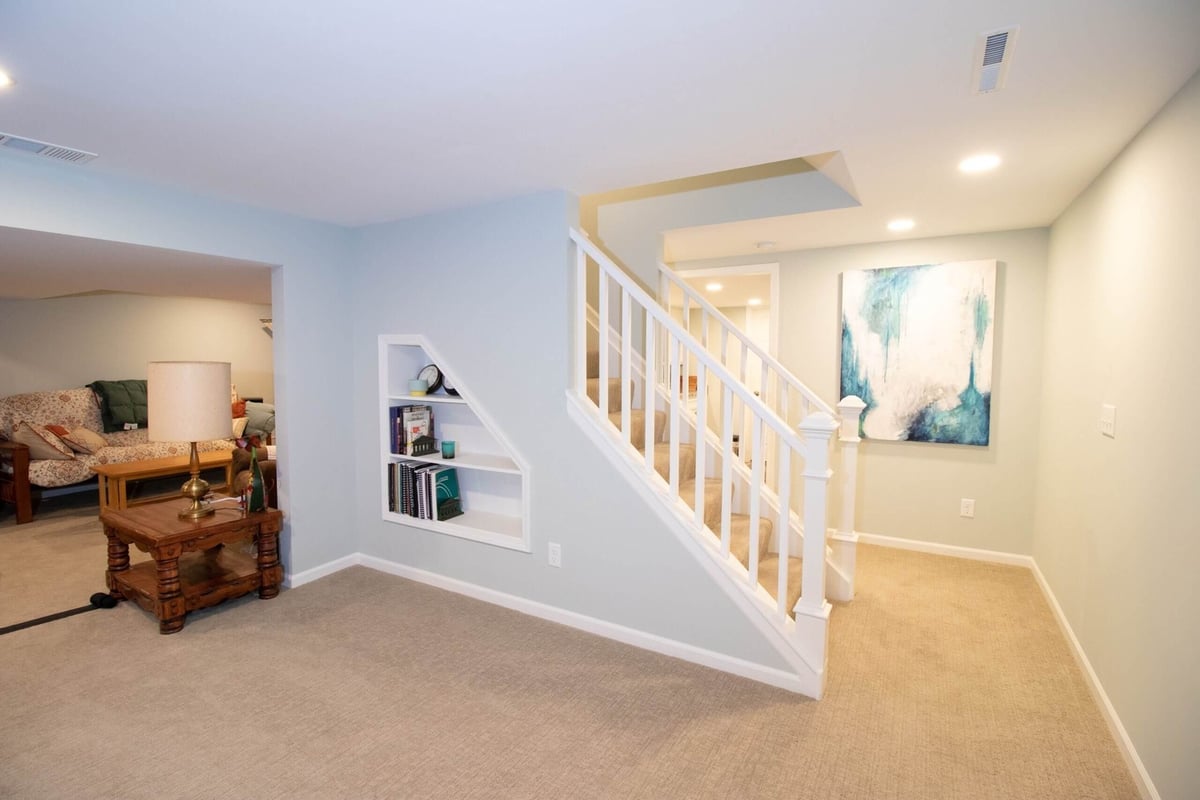 Basement remodel staircase and open living space by Odd Fellows Contracting in Lansing, MI.