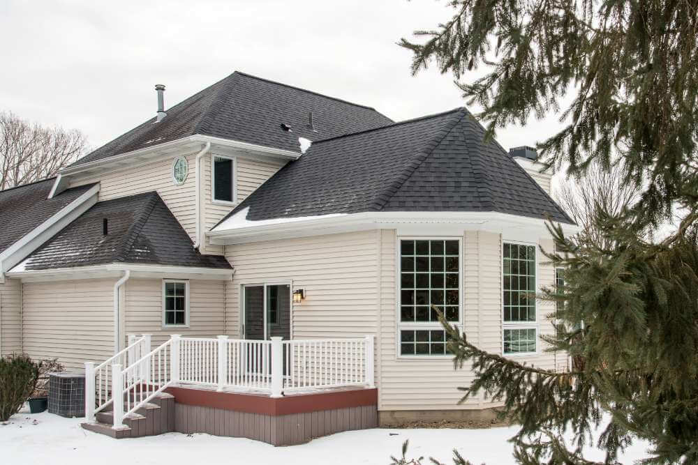 rear view of house after family room addition project by Odd Fellows Contracting in Okemos, MI
