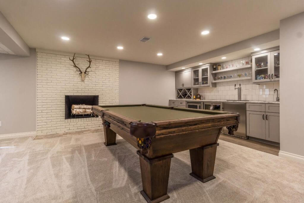 basement remodel with pool table and custom bar cabinetry by Odd Fellows Contracting in East Lansing MI