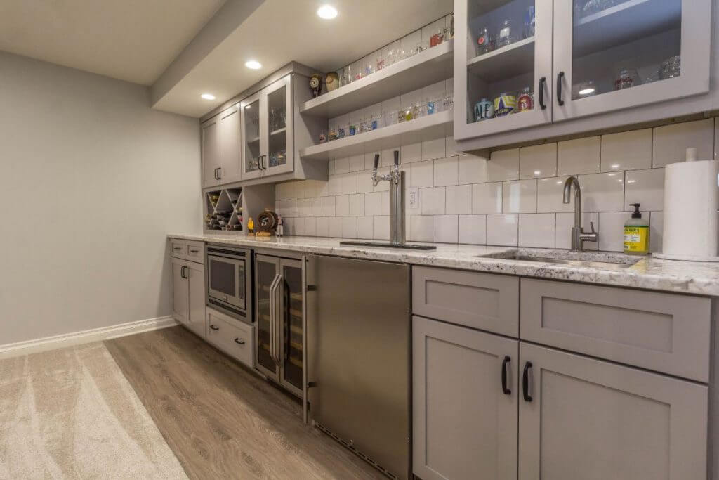 basement renovation featuring custom bar cabinets and countertop by Odd Fellows Contracting in East Lansing MI
