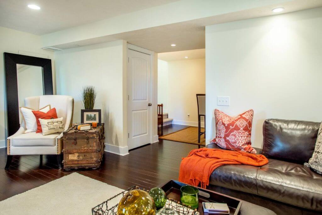 Basement living space renovation with hardwood floors in Lansing MI finished basement project