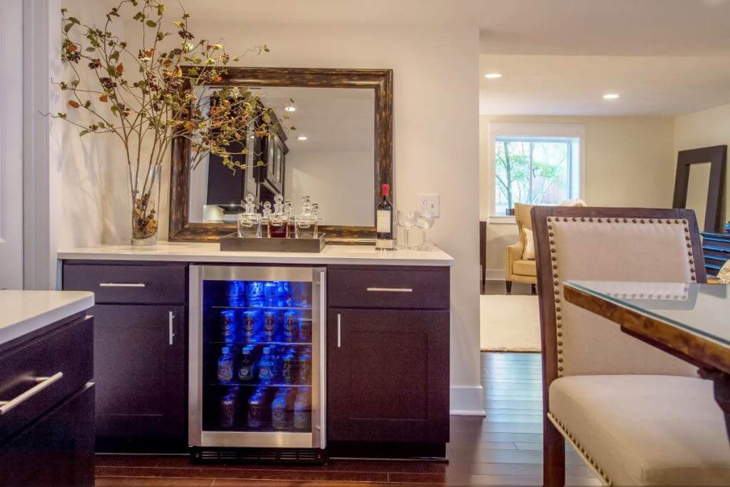 Finished basement bar area with cabinetry and countertops in Lansing MI home remodel