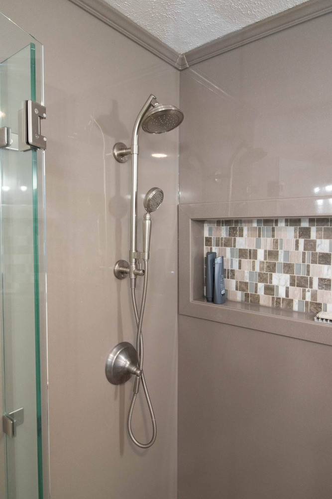 custom shower with mosaic niche in bathroom remodel by Odd Fellows Contracting in Okemos, MI