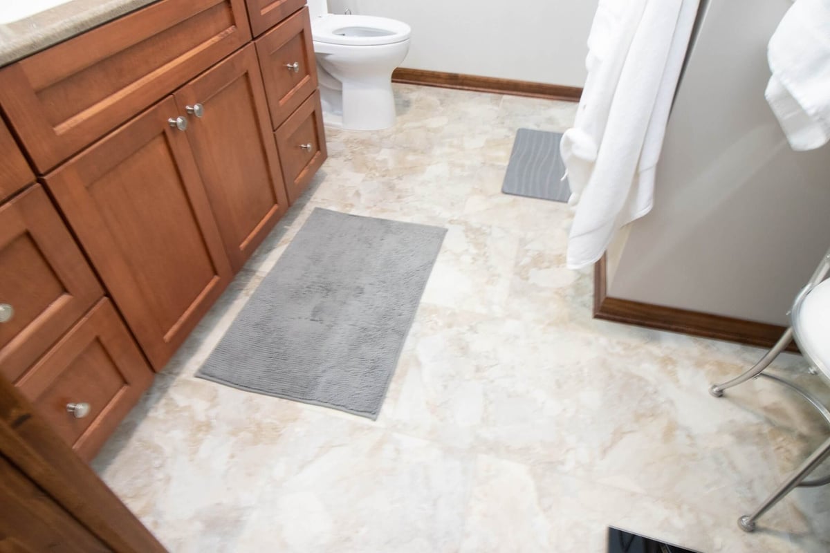 remodeled bathroom interior with custom cabinetry and shower by Odd Fellows Contracting in Okemos, MI