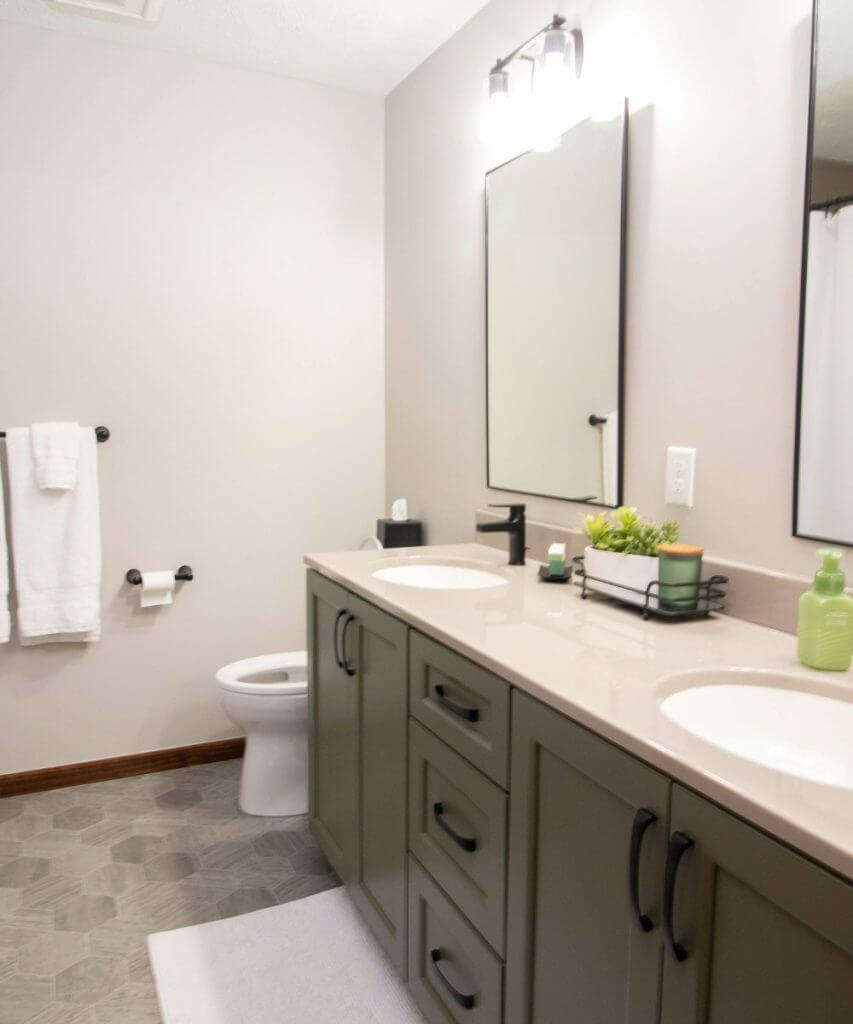 modern bathroom remodel featuring double vanity cabinetry by Odd Fellows Contracting in Okemos, MI