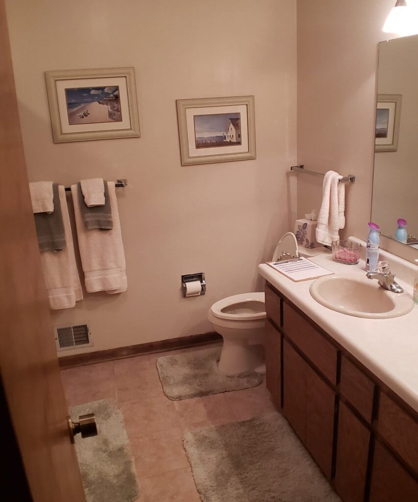 outdated vanity and bathroom interior before renovation by Odd Fellows Contracting in Okemos, MI