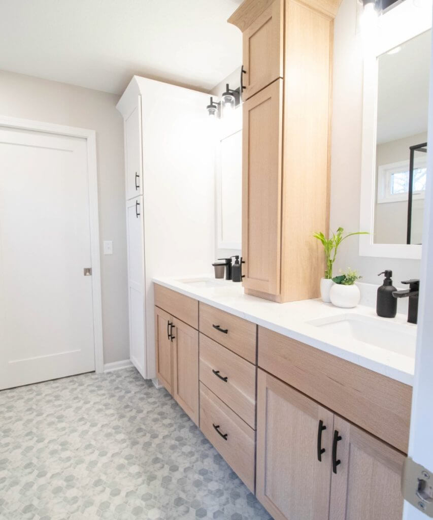 finished bathroom remodel with double vanity and glass shower by Odd Fellows Contracting in Okemos, MI