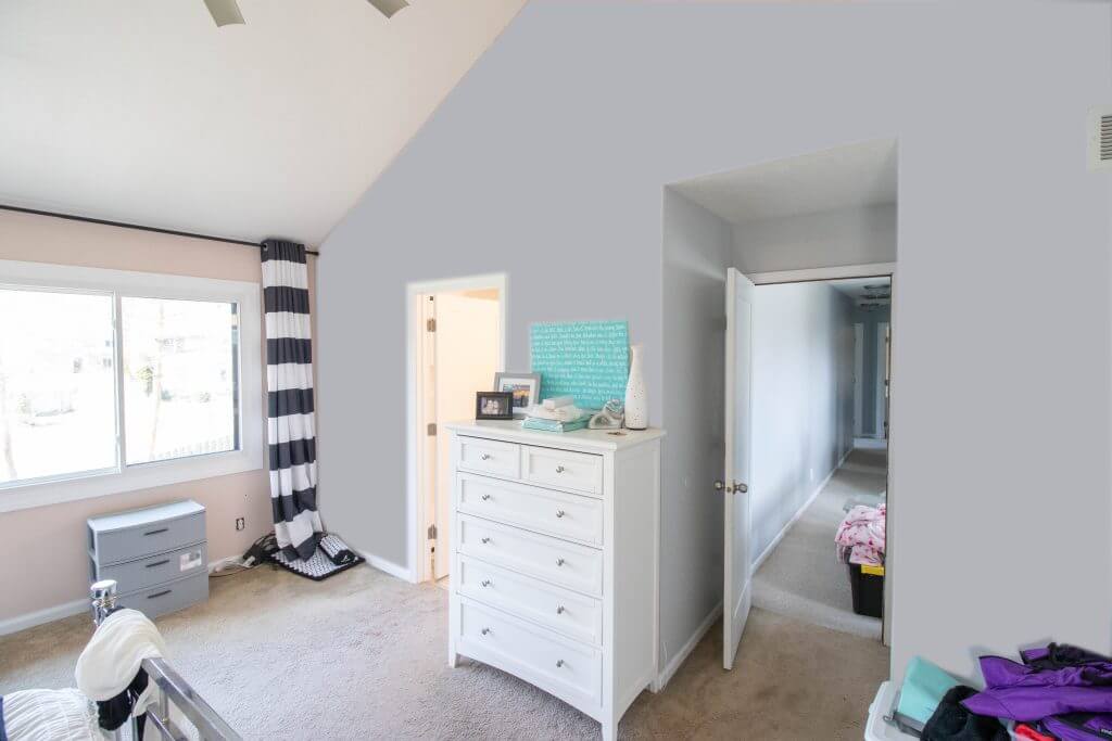 primary bedroom with new doorway leading to remodeled bathroom by Odd Fellows Contracting in Okemos, MI