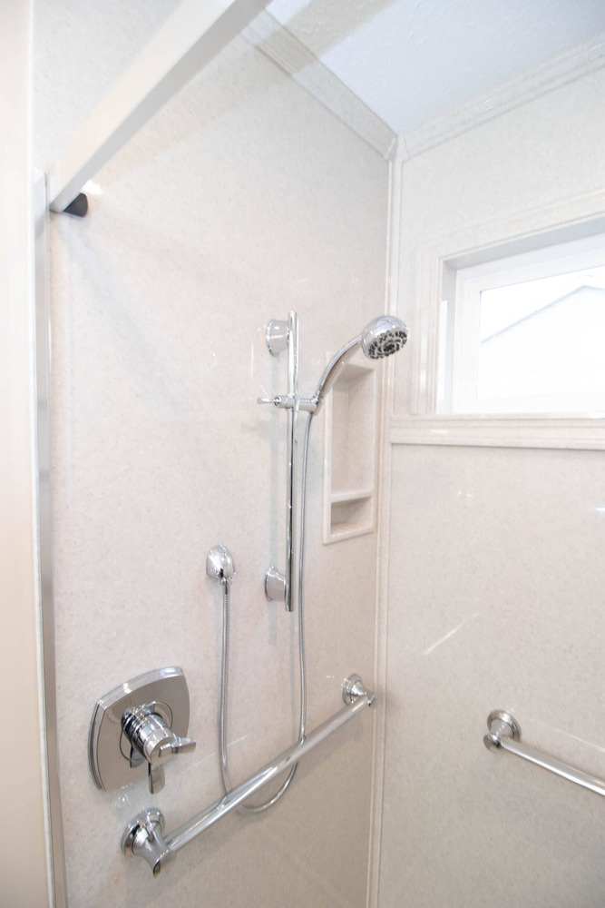 bathroom renovation showcasing modern walk-in shower by Odd Fellows Contracting in Dewitt, MI