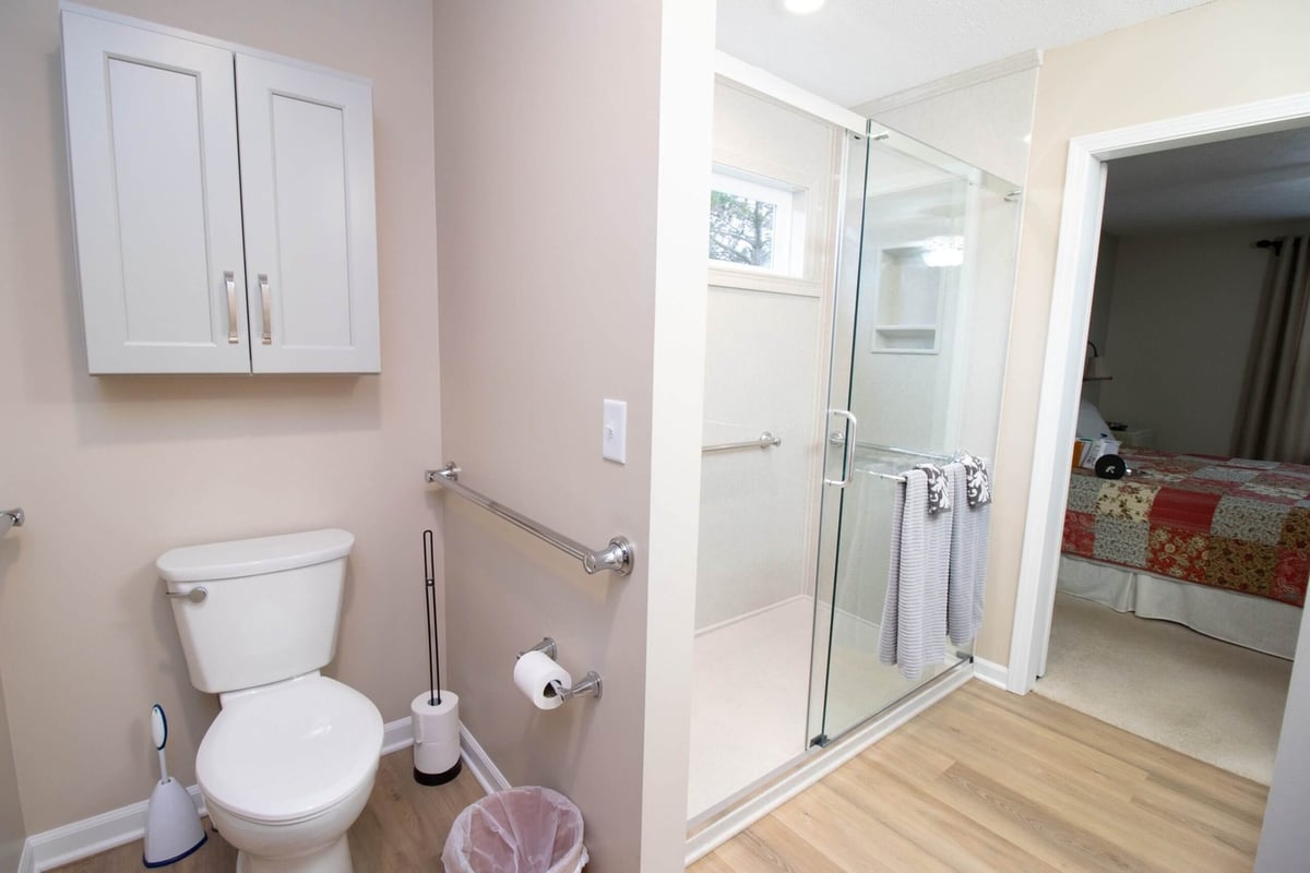 remodeled bathroom with walk-in shower and accessible grab bars by Odd Fellows Contracting in Dewitt, MI