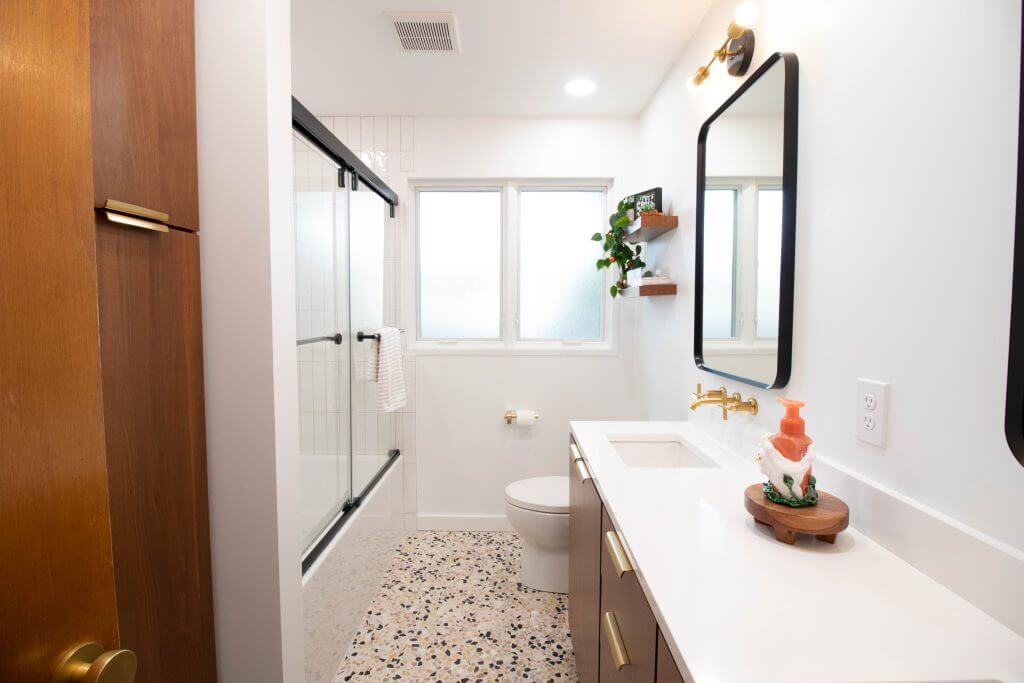 contemporary bathroom vanity and sink area from remodel by Odd Fellows Contracting in Lansing, MI