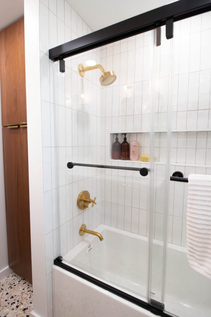 modern bathroom shower and tub combination installed by Odd Fellows Contracting in Lansing, MI
