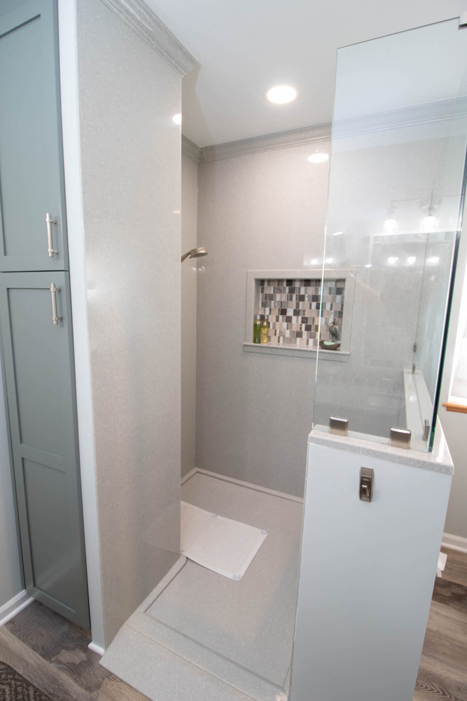 custom walk-in shower with mosaic niche tile by Odd Fellows Contracting in Laingsburg, MI