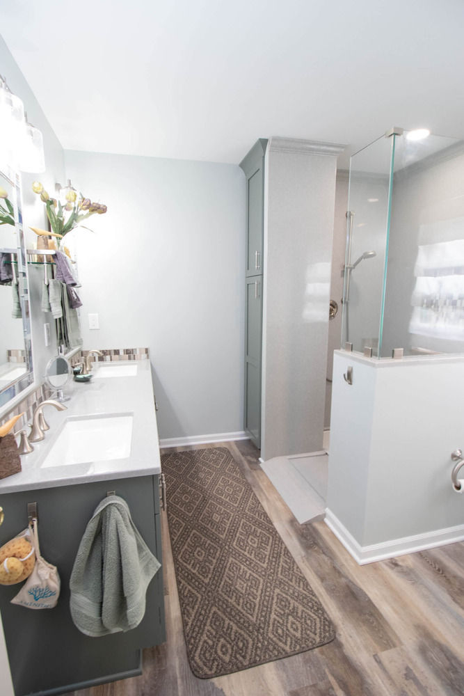 modern bathroom renovation with updated vanity and shower enclosure in Laingsburg, MI by Odd Fellows Contracting