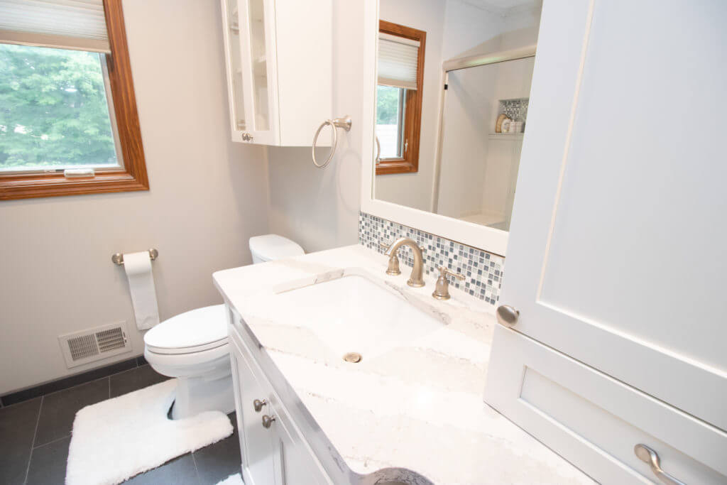 Bathroom vanity with quartz countertop from remodel by Odd Fellows Contracting in Okemos, MI