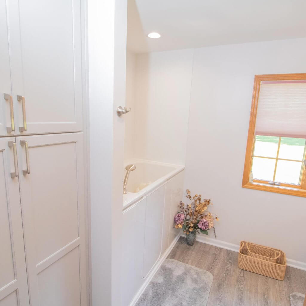 Updated bathroom remodel with glass shower and custom vanity by Odd Fellows Contracting in Williamston, MI