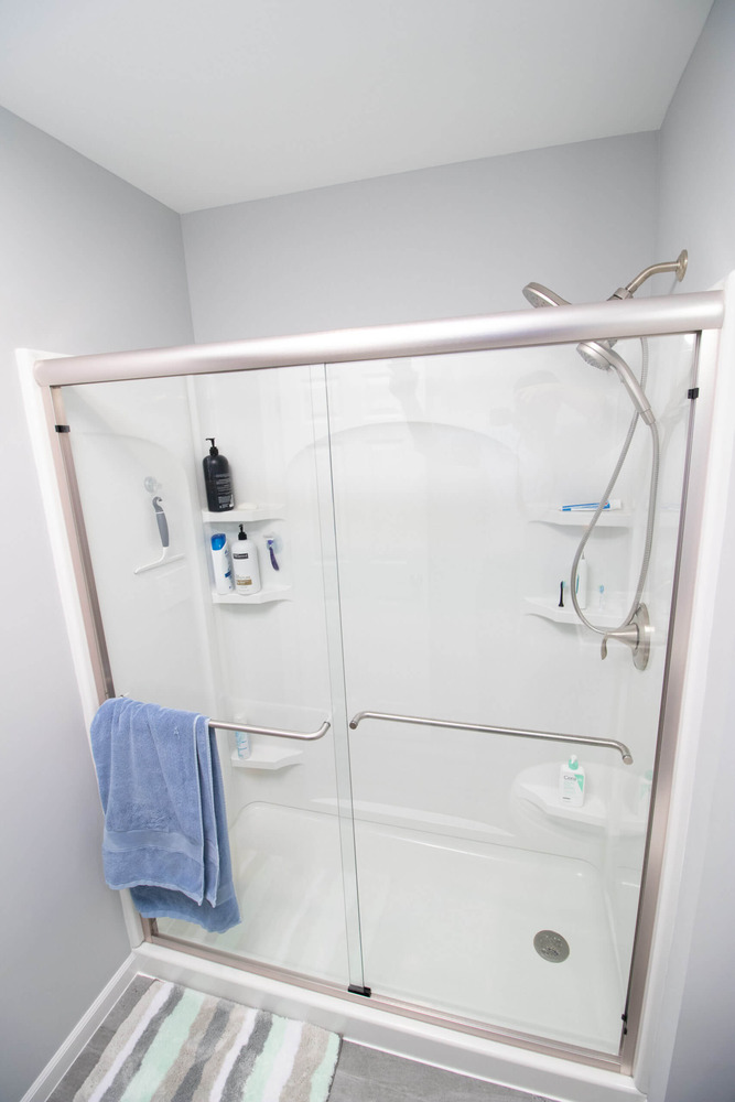 Bathroom addition layout with glass shower, toilet, and pedestal sink by Odd Fellows Contracting in Haslett, MI)