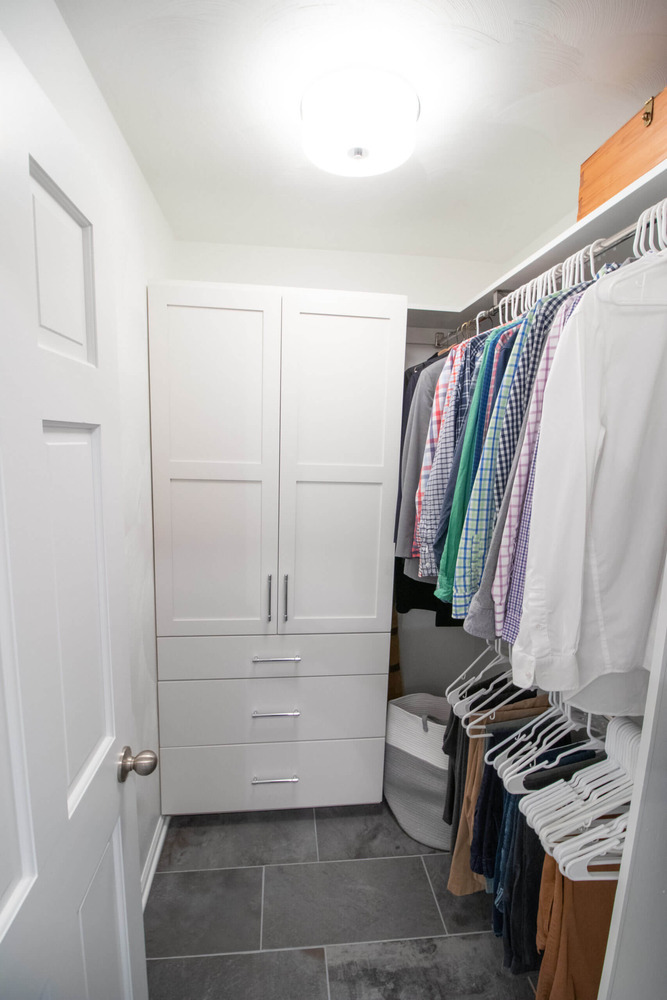custom walk-in closet with cabinetry installed during bathroom remodel by Odd Fellows Contracting in Okemos MI
