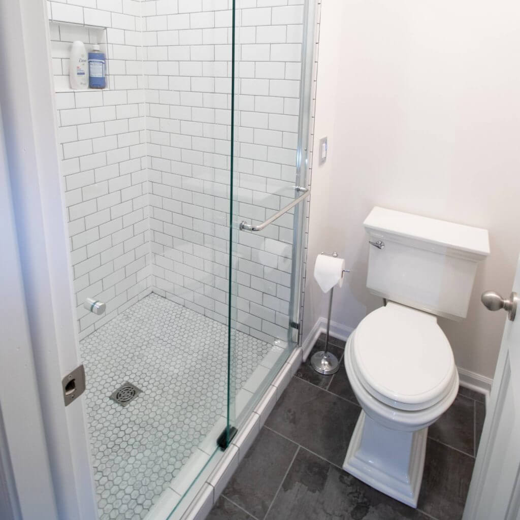finished bathroom remodel with modern tiled shower by Odd Fellows Contracting Okemos MI
