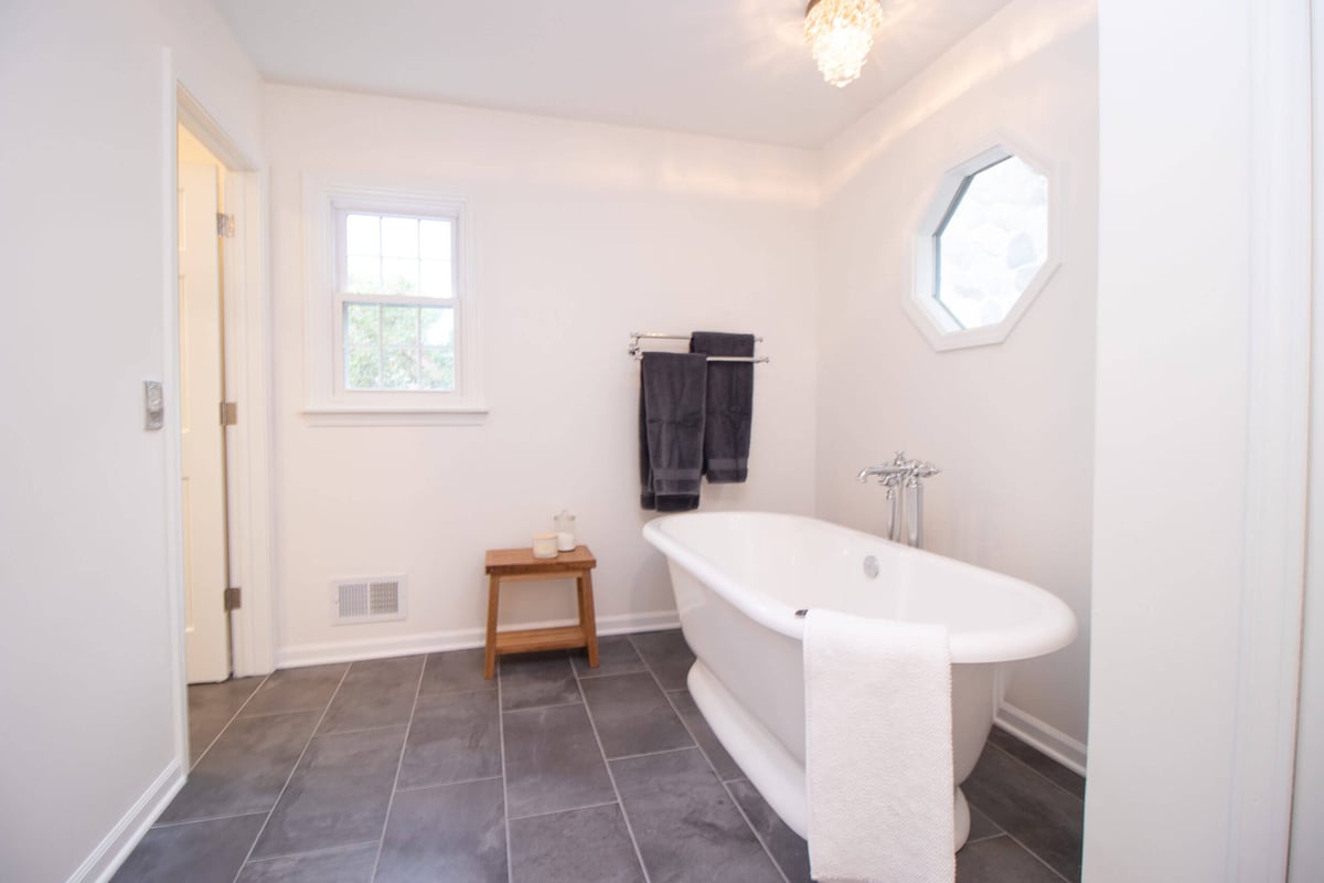 freestanding bathtub in remodeled bathroom by Odd Fellows Contracting in Okemos MI