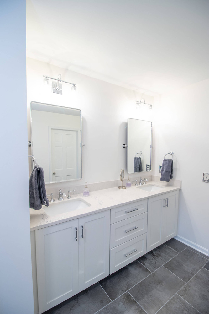 modern bathroom vanity with double sinks by Odd Fellows Contracting in Okemos MI