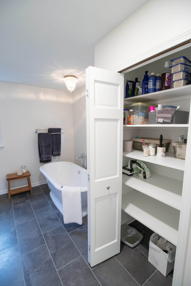 organized closet space with drawers and hanging storage by Odd Fellows Contracting Okemos MI