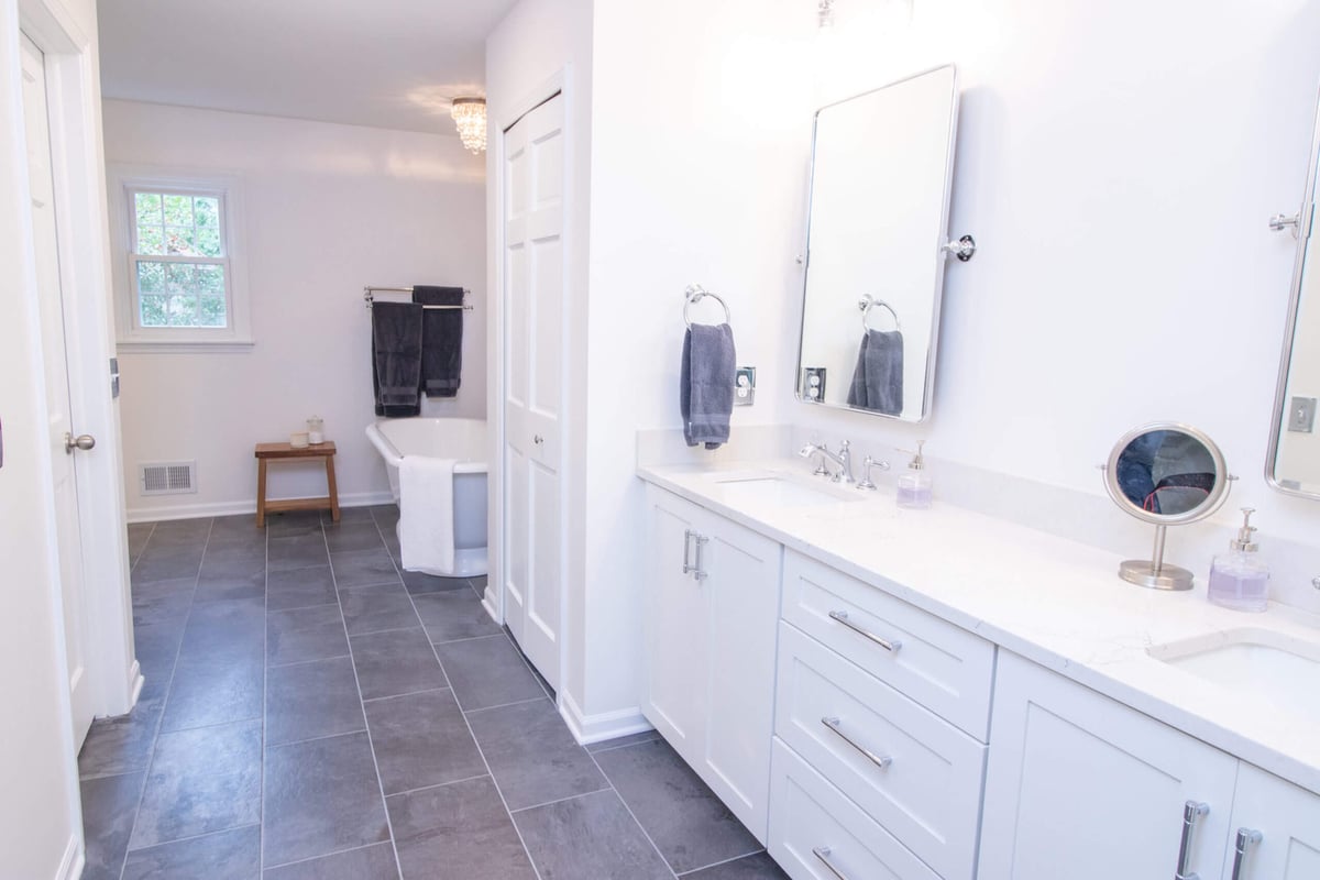 remodeled bathroom with freestanding tub and tile floor by Odd Fellows Contracting in Okemos MI