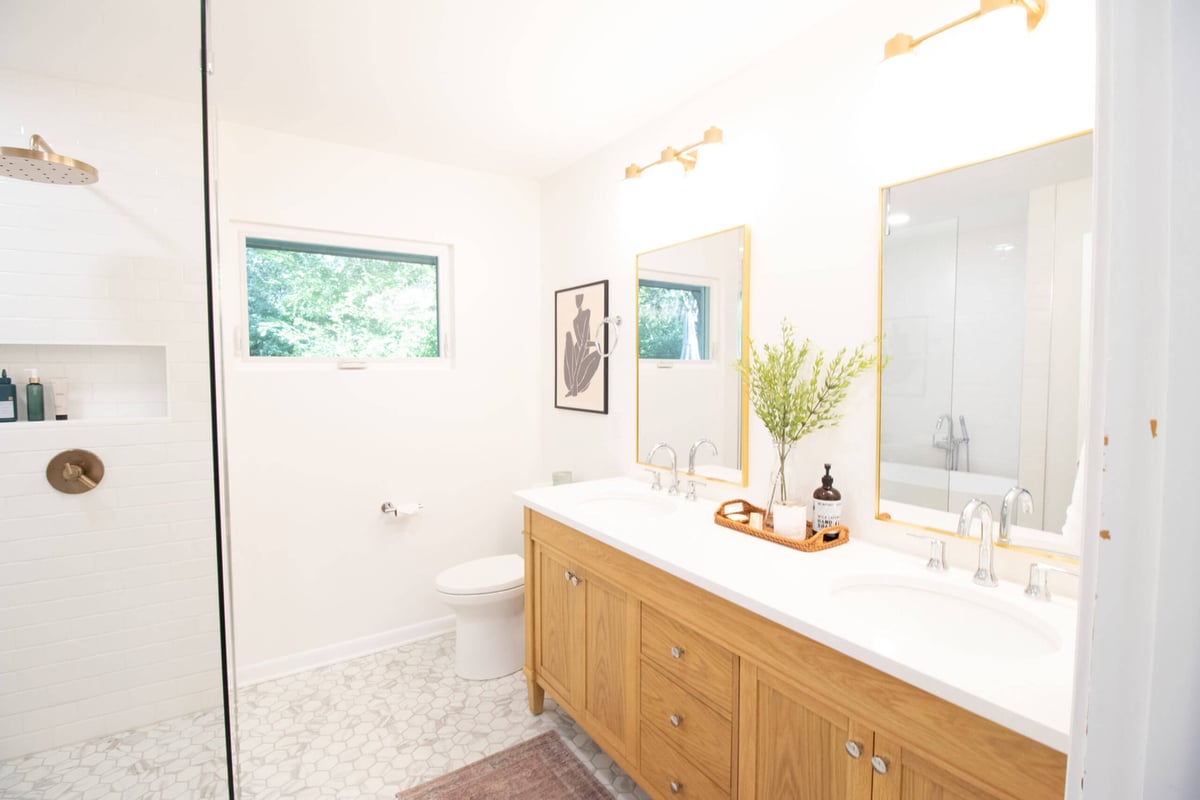 Spacious bathroom remodel with double vanity and walk-in shower by Odd Fellows Contracting in Lansing MI