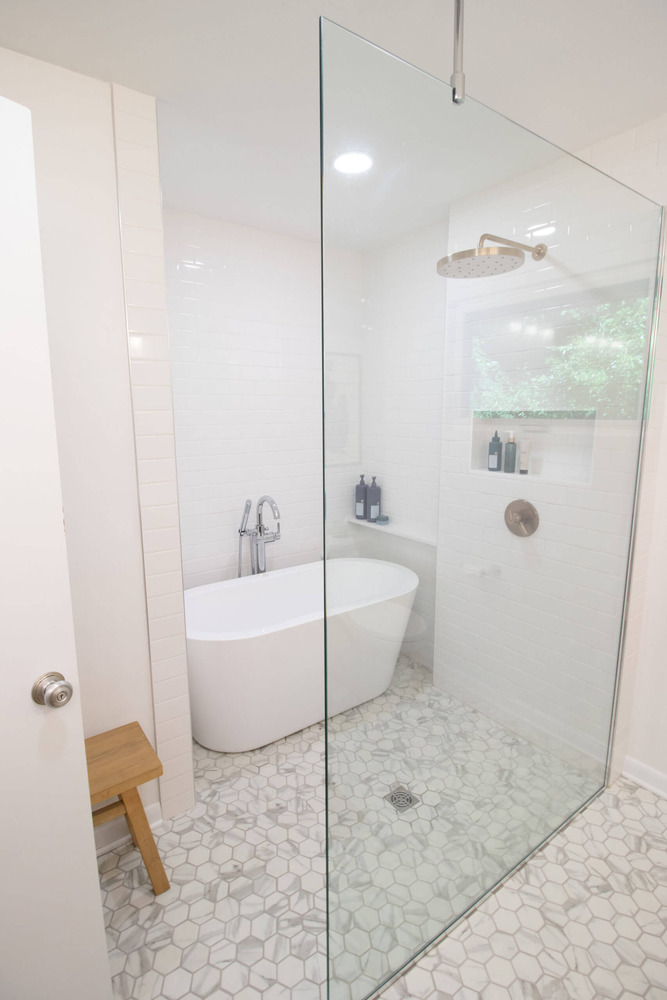 Walk-in glass shower and freestanding tub installed during Lansing MI bathroom remodel
