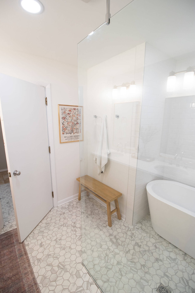 Walk-in shower entry with bench seating in Lansing MI bathroom remodel