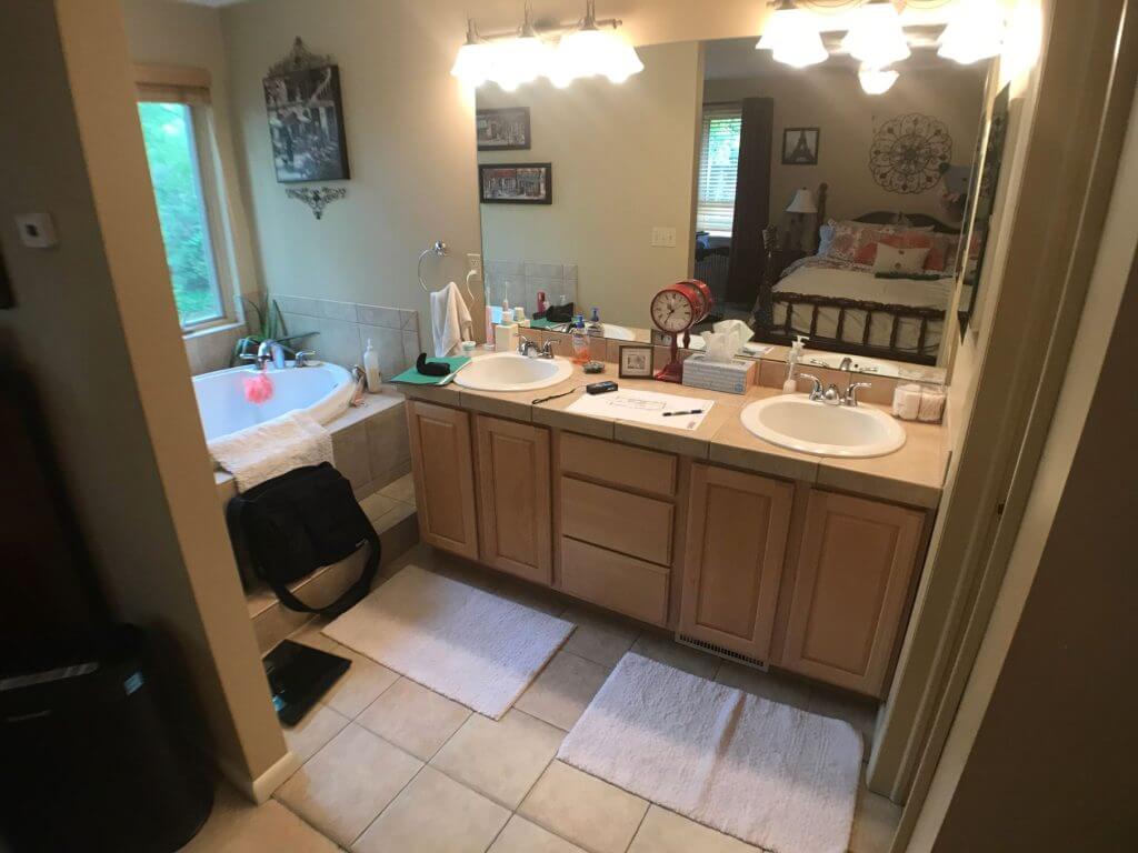bathroom remodel before image by Odd Fellows Contracting in Owosso MI with outdated vanity and tub