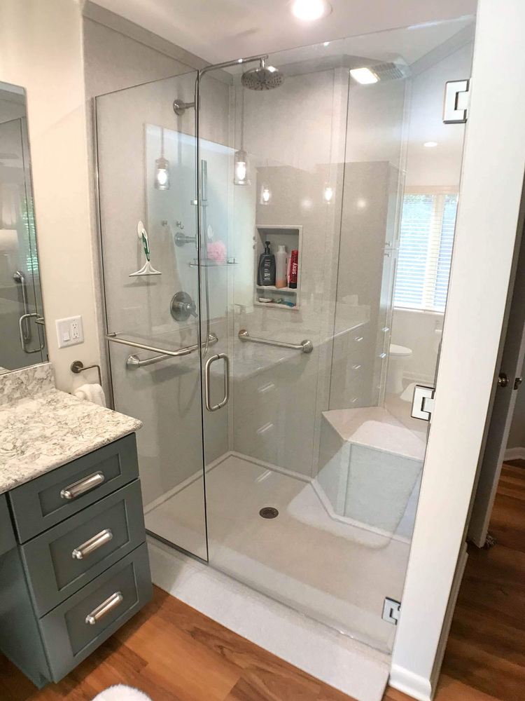 bathroom remodel by Odd Fellows Contracting in Owosso MI with glass walk-in shower and modern tile