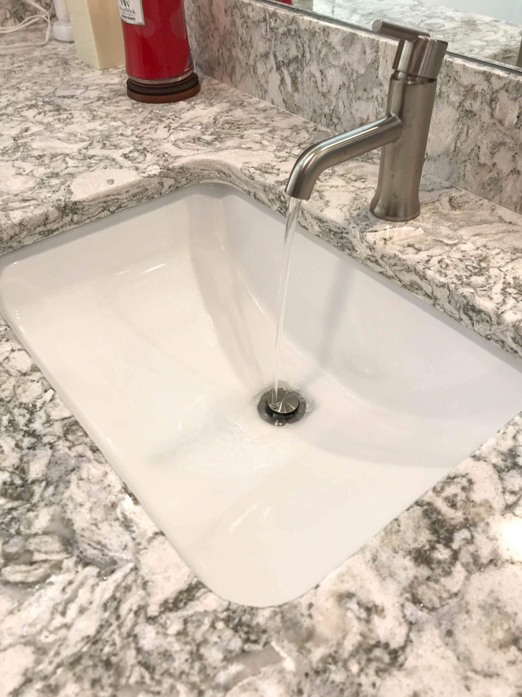 bathroom renovation by Odd Fellows Contracting featuring updated sink and countertop detail