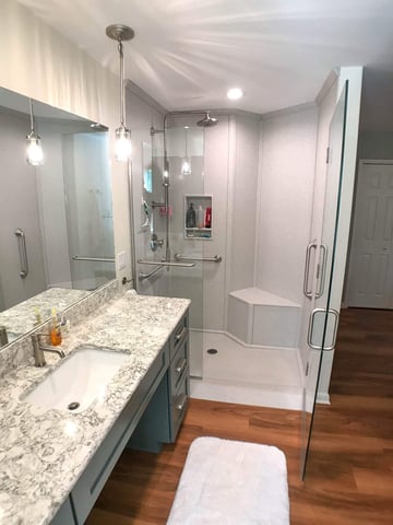 remodeled bathroom shower by Odd Fellows Contracting in Owosso MI with sleek glass enclosure