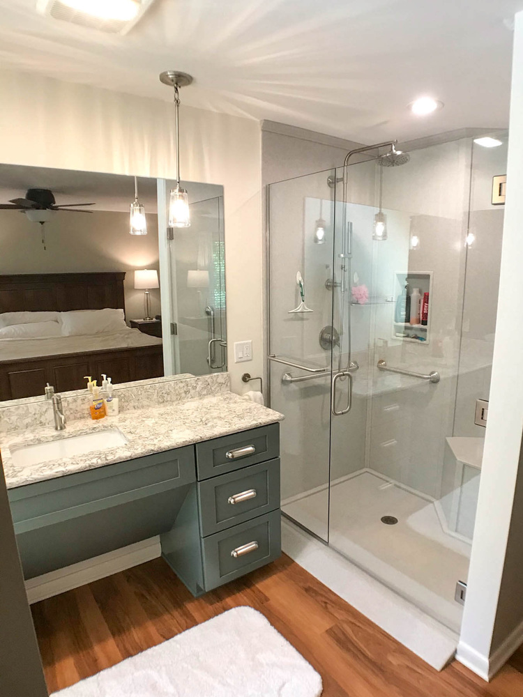 remodeled bathroom vanity by Odd Fellows Contracting in Owosso MI with updated fixtures and storage