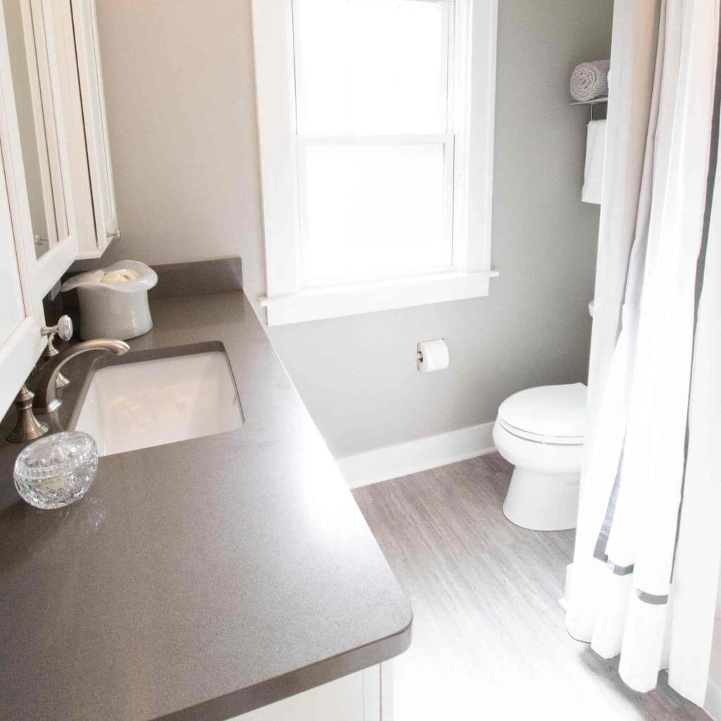 updated bathroom sink and vanity by Odd Fellows Contracting in East Lansing MI with neutral finishes