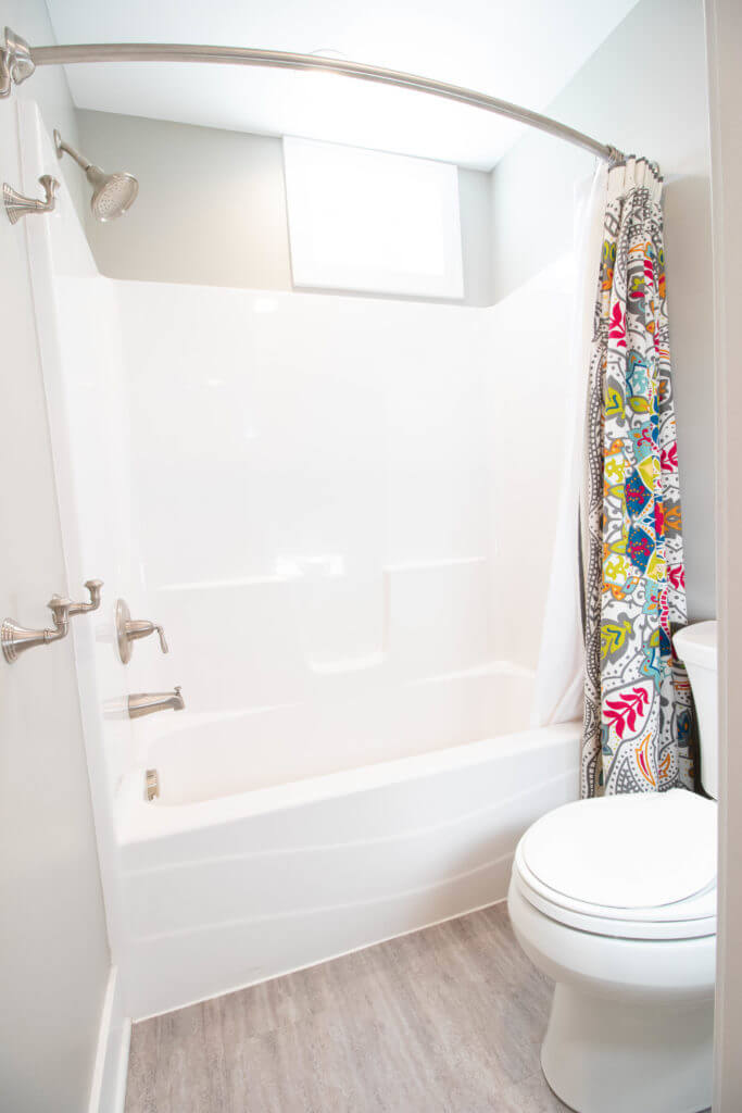 updated bathtub and shower by Odd Fellows Contracting in East Lansing MI with modern fixtures