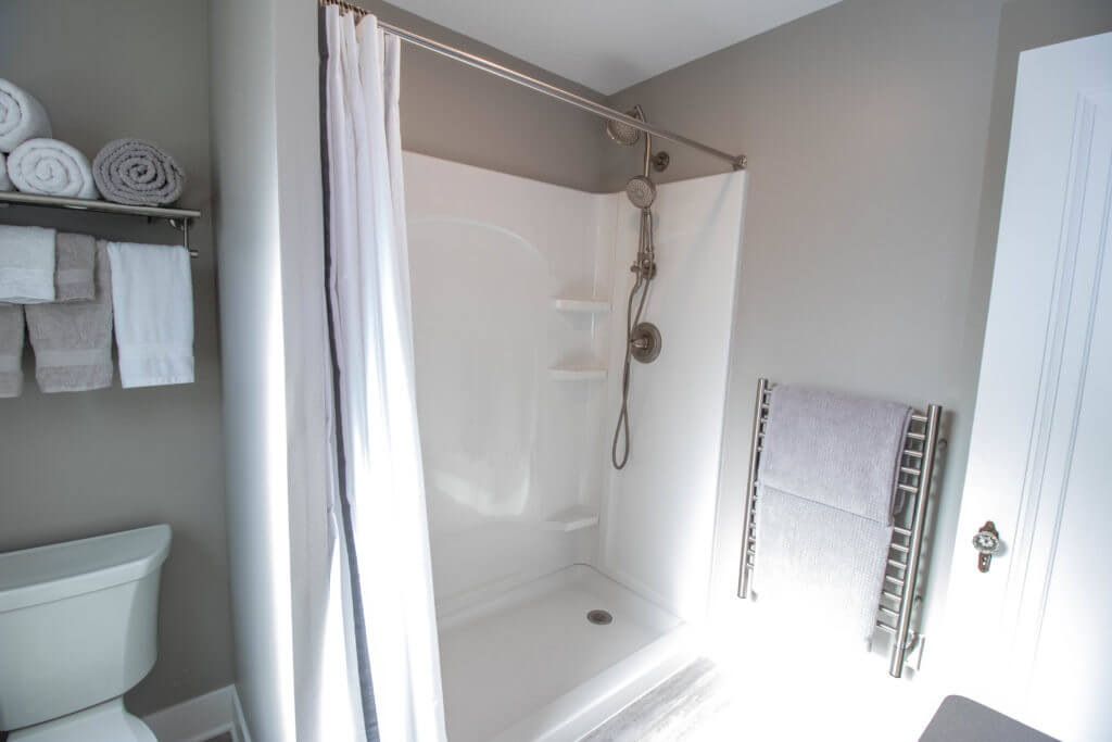 updated shower installation by Odd Fellows Contracting in East Lansing MI with handheld showerhead