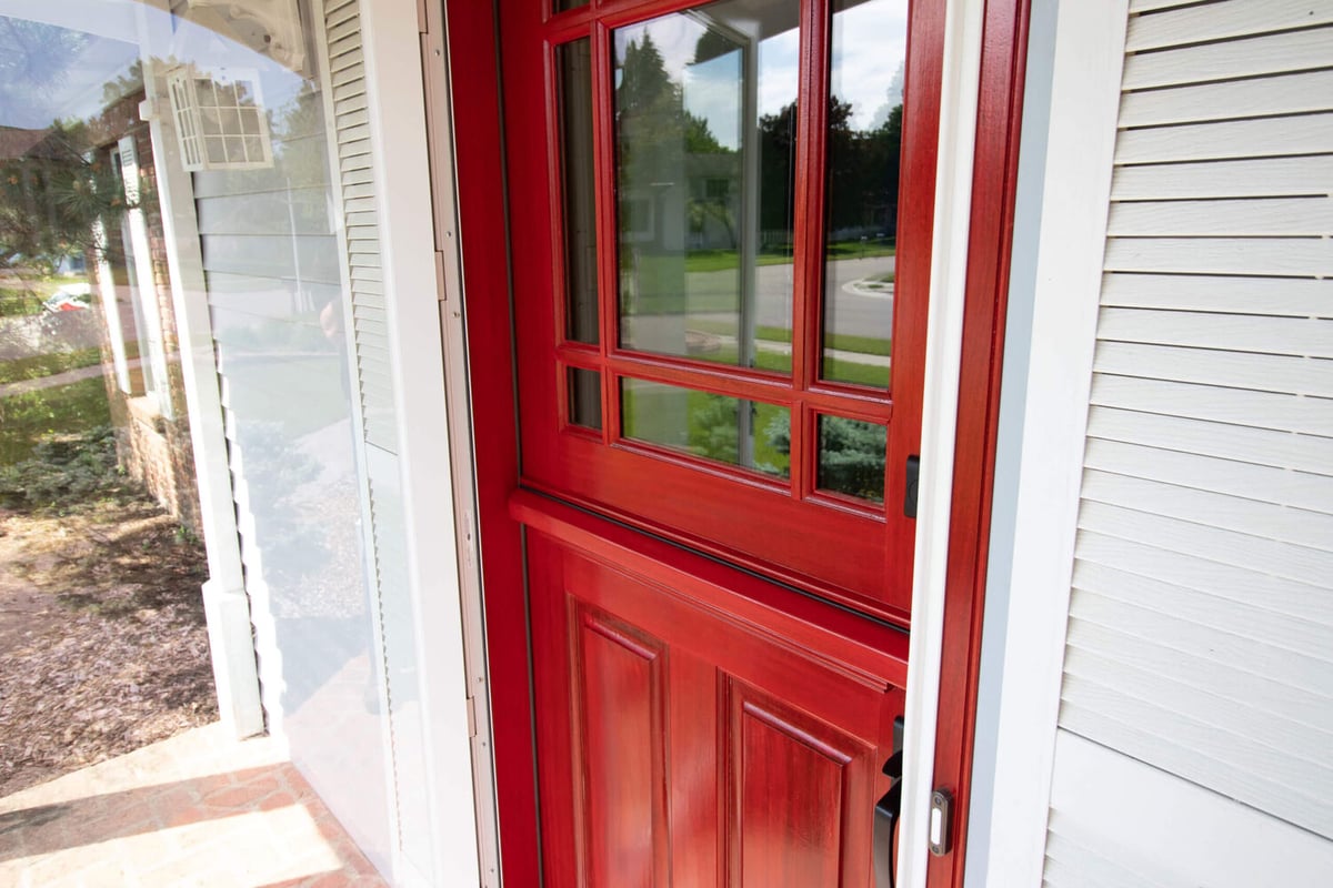 front entry remodel by Odd Fellows Contracting in Okemos MI with red door and sidelights