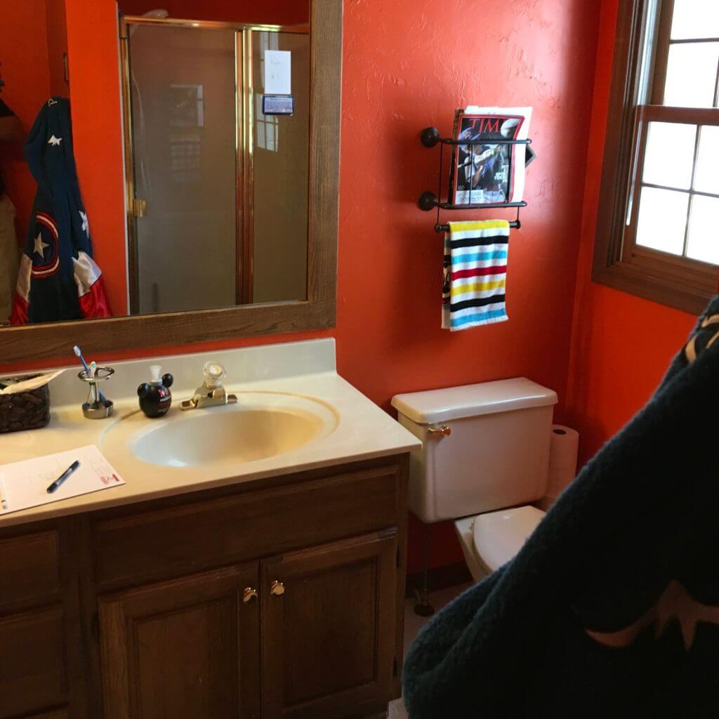 original bathroom vanity and sink before remodel by Odd Fellows Contracting in Okemos, MI