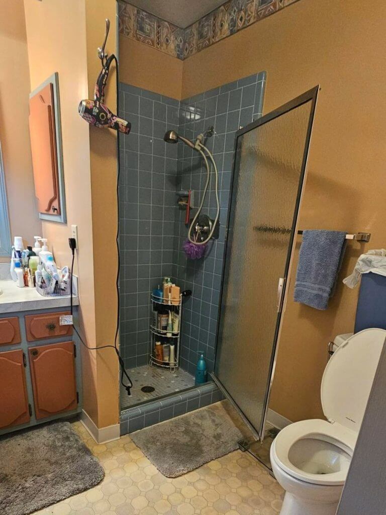before bathroom remodel by Odd Fellows Contracting in Briarwood Okemos, MI featuring dated shower and tile