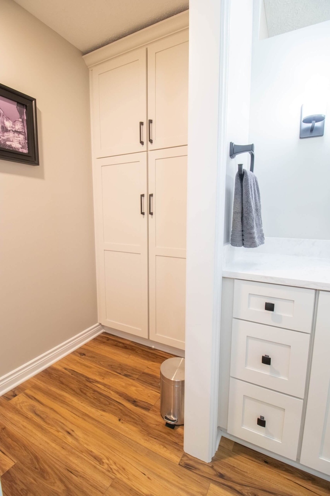Portland, MI bathroom renovation by Odd Fellows Contracting featuring built-in cabinetry and updated vanity