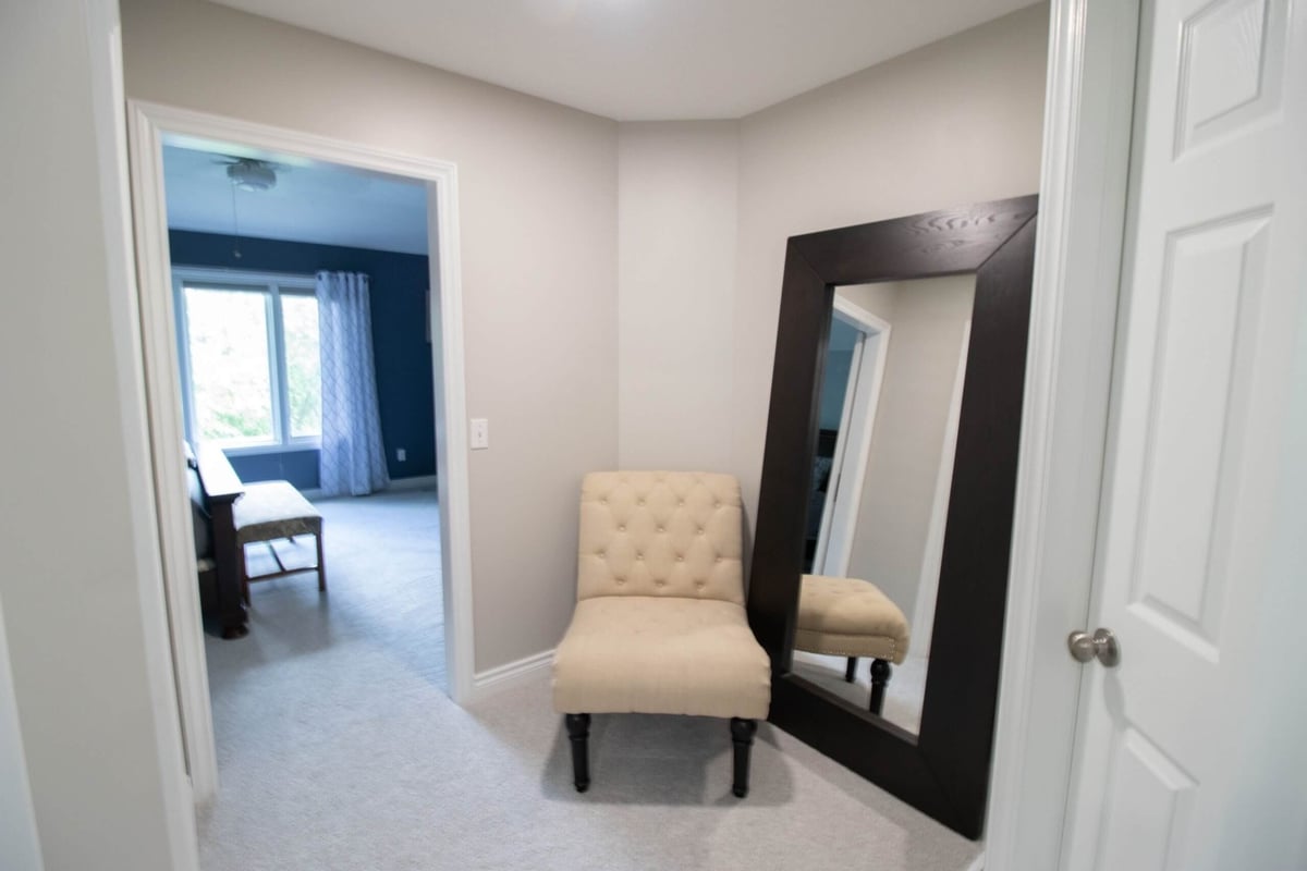 adjoining bedroom entry from bathroom remodel by Odd Fellows Contracting in Portland, MI with updated flooring