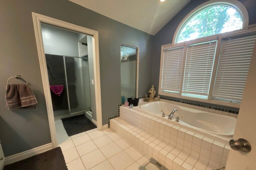bathroom remodel by Odd Fellows Contracting in Portland, MI showcasing freestanding shower and new vanity