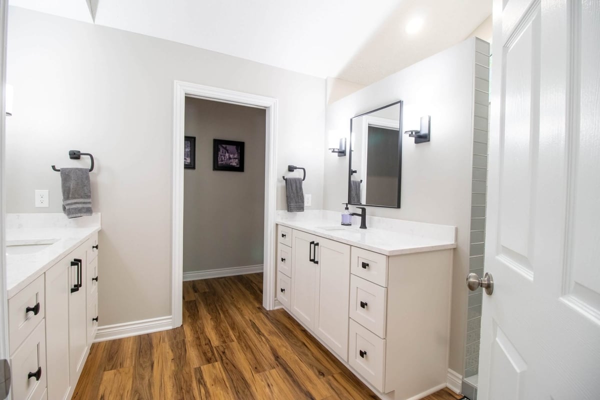 modern bathroom remodel by Odd Fellows Contracting in Portland, MI featuring quartz countertops and dual sinks