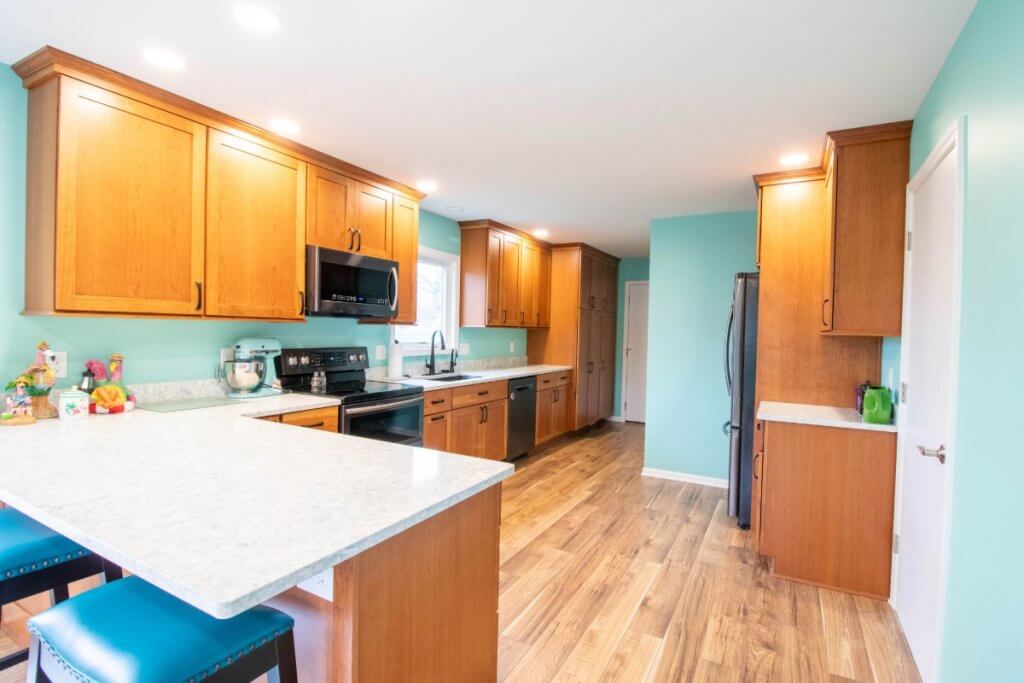 updated kitchen corner view in custom home by Odd Fellows Contracting in Lansing, MI