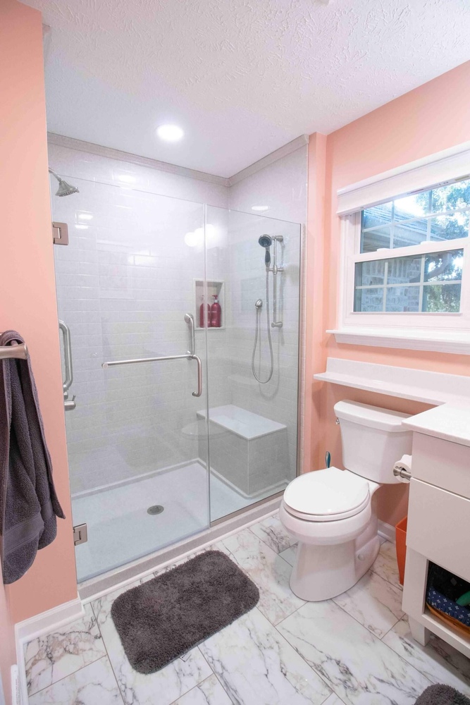 Bathroom remodel with walk-in glass shower by Odd Fellows Contracting in Mason, MI