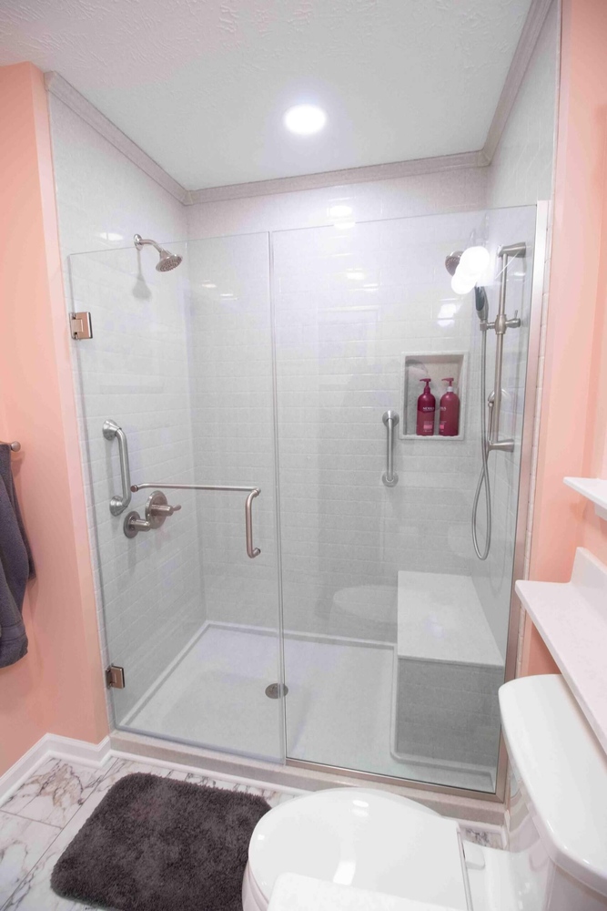 Bathroom remodel with walk-in glass shower by Odd Fellows Contracting in Williamston, MI