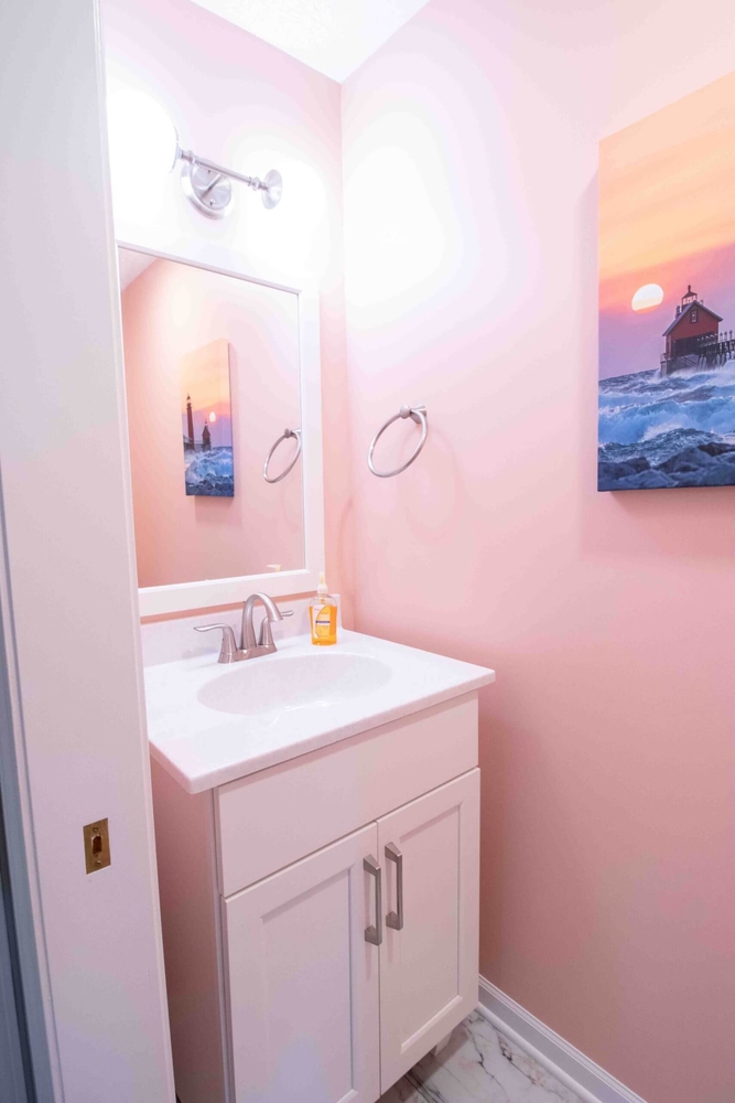 Small bathroom vanity upgrade in bathroom remodel by Odd Fellows Contracting in Williamston, MI