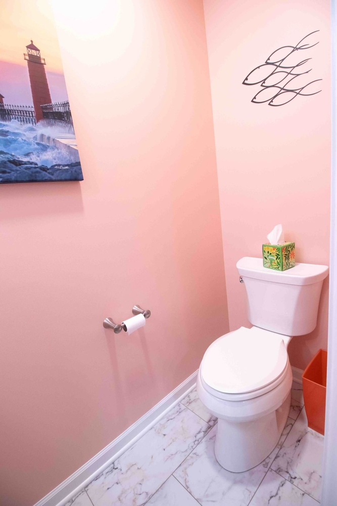 Updated toilet area in bathroom remodel by Odd Fellows Contracting in Williamston, MI